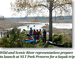 Wild and Scenic River representatives prepare to launch at NLT Peek Preserve for a kayak trip