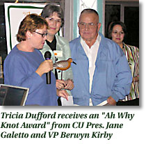 Tricia Dufford receives an "Ah Why Knot Award" form CU pres. Jane Galetto and VP Berwyn Kirby