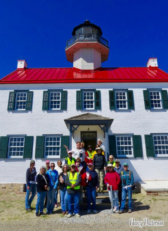 CU ReTurn the Favor volunteers pose on the steps of East Point Lighthouse