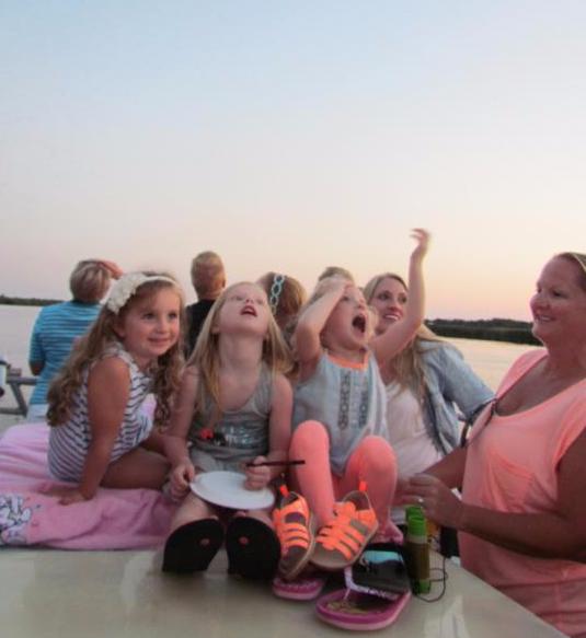  Kids watch purple martins swirl.