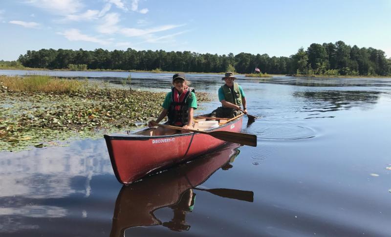 Sarah and Fred look for dragonfly larve on Cumberland Pond.